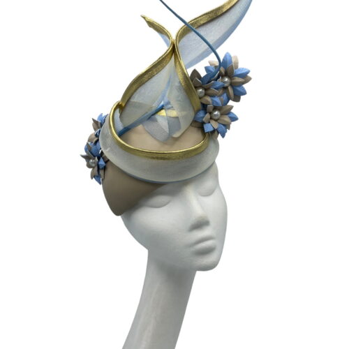 Stunning nude leather teardrop shaped headpiece with baby blue and nude handmade flowers and gold trim detail to finish.